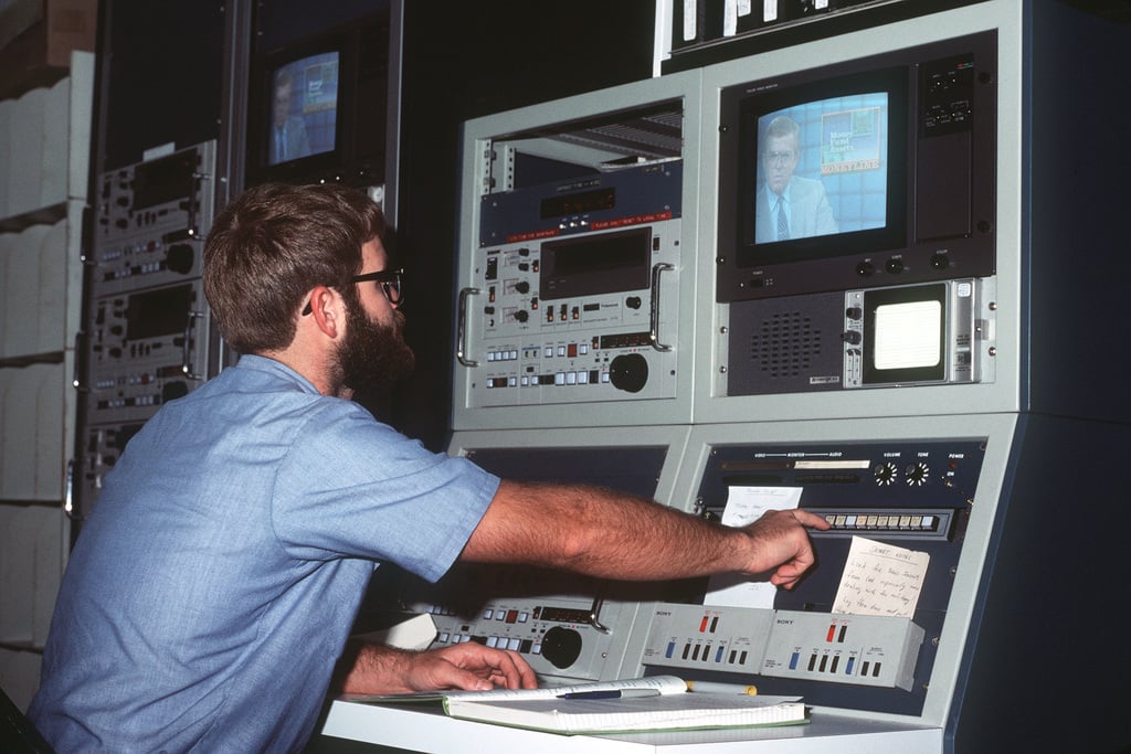 A member of the Armed Forces Radio and Television Service operates video equipment